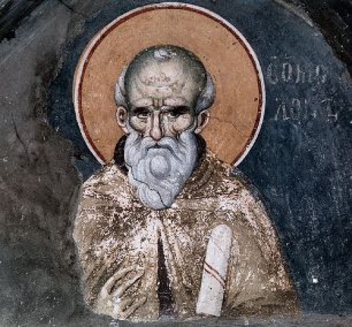 "Ἡ &phi;&omega;&nu;ή &tau;&omicron;ῦ Ἁ&gamma;ί&omicron;&upsilon; &Mu;&alpha;&xi;ί&mu;&omicron;&upsilon; &tau;&omicron;ῦ Ὁ&mu;&omicron;&lambda;&omicron;&gamma;&eta;&tau;&omicron;ῦ" &Gamma;&rho;ά&phi;&epsilon;&iota; ὁ &Phi;ώ&tau;&eta;&sigmaf; &Mu;&iota;&chi;&alpha;ή&lambda;, ἰ&alpha;&tau;&rho;ό&sigmaf;